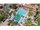 Beautiful aerial view of the community pool area, surrounded by palm trees and inviting lounge areas at 7405 N Via Camello Del Norte -- # 137, Scottsdale, AZ 85258
