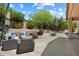 Inviting backyard oasis with a shimmering pool, lush landscaping, and comfortable patio seating for relaxing and entertaining at 7438 E Glenn Moore Rd, Scottsdale, AZ 85255