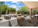 Relaxing outdoor space with lounge furniture, dining area, and access to a refreshing swimming pool at 7438 E Glenn Moore Rd, Scottsdale, AZ 85255