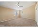Large bedroom with neutral walls, carpet flooring and large windows providing lots of natural light at 7438 E Glenn Moore Rd, Scottsdale, AZ 85255