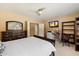 Bedroom featuring a ceiling fan, a work station, and neutral colored walls at 7438 E Glenn Moore Rd, Scottsdale, AZ 85255