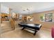 Game room with pool table, views to the outside, and access to the kitchen at 7438 E Glenn Moore Rd, Scottsdale, AZ 85255