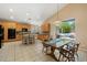Open concept kitchen with an island, modern appliances, and easy access to outdoor entertainment area at 7438 E Glenn Moore Rd, Scottsdale, AZ 85255