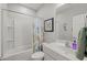 Neat secondary bathroom with shower over tub and floral curtain at 7732 S 23Rd St, Phoenix, AZ 85042