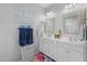 Well-lit bathroom featuring double sinks and decorative mirrors at 7732 S 23Rd St, Phoenix, AZ 85042