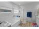 Clean bathroom featuring a soaking tub and a glass-enclosed shower at 7732 S 23Rd St, Phoenix, AZ 85042