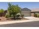 Attractive single-story home featuring a neutral color scheme and well-maintained landscaping with a two car garage at 7732 S 23Rd St, Phoenix, AZ 85042