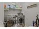 Well-equipped laundry room with modern washer and dryer, shelving and organized storage at 7732 S 23Rd St, Phoenix, AZ 85042