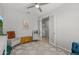Inviting living room with ample seating, ceiling fan, and French doors to a room beyond at 7732 S 23Rd St, Phoenix, AZ 85042