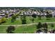 An aerial view of lush greenbelt community with well-maintained lawns, mature trees, and neighborhood homes at 8228 S Stephanie Ln, Tempe, AZ 85284