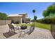 Spacious backyard patio features pavers, a fire pit, and views of the home and pool area at 8228 S Stephanie Ln, Tempe, AZ 85284
