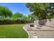 Cozy backyard patio boasts pavers, a fire pit, and comfortable seating for outdoor relaxation at 8228 S Stephanie Ln, Tempe, AZ 85284