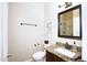 Well-appointed bathroom with granite countertops, a modern sink, and a framed mirror above the toilet and vanity at 8228 S Stephanie Ln, Tempe, AZ 85284