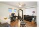 Bright bedroom featuring wood floors, a large mirror, desk, and Pilates equipment at 8228 S Stephanie Ln, Tempe, AZ 85284