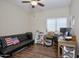 Bedroom with wooden floors, ceiling fan, and a window to let in plenty of natural light at 8228 S Stephanie Ln, Tempe, AZ 85284