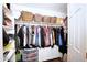 Well-organized walk-in closet with hanging rods, shelves, and drawers for clothing and accessories at 8228 S Stephanie Ln, Tempe, AZ 85284