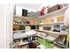Pantry features multiple shelves filled with linens, baskets, and household goods at 8228 S Stephanie Ln, Tempe, AZ 85284