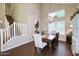 A dining room with wood floors, ample natural light and modern chandelier at 8228 S Stephanie Ln, Tempe, AZ 85284