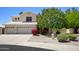 Charming two-story home with a three car garage, mature landscaping, and large driveway at 8228 S Stephanie Ln, Tempe, AZ 85284