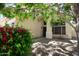 Charming two-story home with mature landscaping, flag, and covered porch entryway at 8228 S Stephanie Ln, Tempe, AZ 85284