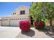 Charming two-story home with mature landscaping, flag, and a three car garage at 8228 S Stephanie Ln, Tempe, AZ 85284
