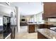 Open kitchen with stainless appliances, granite countertops and seamless flow to living spaces at 8228 S Stephanie Ln, Tempe, AZ 85284