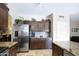 Bright kitchen featuring stainless appliances, ample storage, and an open, flowing floorplan at 8228 S Stephanie Ln, Tempe, AZ 85284