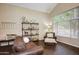 A cozy living room with hardwood floors, large windows, and comfortable seating, creating an inviting space at 8228 S Stephanie Ln, Tempe, AZ 85284