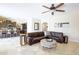 Inviting living room seamlessly connects to the kitchen, creating an ideal space for modern living and entertaining at 8228 S Stephanie Ln, Tempe, AZ 85284