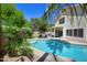 Sparkling pool with desert landscaping, a covered patio, and mature trees at 8228 S Stephanie Ln, Tempe, AZ 85284