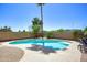 Inviting pool area is surrounded by lush landscaping and offers a relaxing outdoor retreat at 8228 S Stephanie Ln, Tempe, AZ 85284