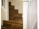 A Wooden staircase with white painted banisters adds a touch of elegance to the home's interior at 8228 S Stephanie Ln, Tempe, AZ 85284