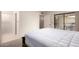 Bright bedroom featuring a large bed, access to the patio, ensuite bathroom, and closet at 8255 E Kiva Ave # 420, Mesa, AZ 85209