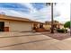 Street view of attractive single-story home with two-car garage, desert landscaping, and inviting front entrance at 8255 E Kiva Ave # 420, Mesa, AZ 85209