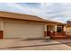 Single-story home featuring a two-car garage, desert landscaping, and appealing front with brick accents at 8255 E Kiva Ave # 420, Mesa, AZ 85209