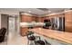 Traditional kitchen featuring stainless steel appliances, wooden cabinets, and a wooden breakfast bar island at 8255 E Kiva Ave # 420, Mesa, AZ 85209