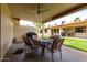 Inviting covered patio area with ceiling fan and outdoor dining set perfect for relaxing and entertaining at 8255 E Kiva Ave # 420, Mesa, AZ 85209
