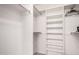 Spacious walk-in closet with shelving units and hanging rods for ample storage at 8255 E Kiva Ave # 420, Mesa, AZ 85209
