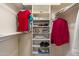 Organized walk-in closet with shelving and hanging space for clothes and accessories at 8255 E Kiva Ave # 422, Mesa, AZ 85209
