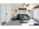 Inviting living room featuring a comfortable sofa, ceiling fan, and natural light at 8255 E Kiva Ave # 422, Mesa, AZ 85209