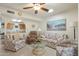 Cozy living room with classic furniture, tile floors, and an open view to kitchen at 8255 E Kiva Ave # 422, Mesa, AZ 85209