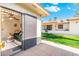 View from patio with sliding screen door looking into living room with outdoor grass and another building at 8255 E Kiva Ave # 422, Mesa, AZ 85209