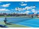 Brightly colored tennis court on a sunny day, promising fun and friendly competition at 8255 E Kiva Ave # 422, Mesa, AZ 85209