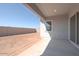 Covered patio with view of the large backyard and privacy fence at 852 W Golden Ore Pass, Apache Junction, AZ 85120