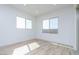 Light-filled bedroom with neutral walls and wood-style tile flooring at 852 W Golden Ore Pass, Apache Junction, AZ 85120