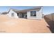 Back exterior of home with covered patio and large backyard at 852 W Golden Ore Pass, Apache Junction, AZ 85120