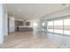 Open-concept living area and kitchen with recessed lighting and sliding glass doors to the back yard at 852 W Golden Ore Pass, Apache Junction, AZ 85120