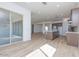 Open-concept living area and kitchen with recessed lighting and sliding glass doors to the patio at 852 W Golden Ore Pass, Apache Junction, AZ 85120