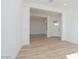 Bright living room featuring an open layout, white trim, recessed lights and wood-look tile floor at 852 W Golden Ore Pass, Apache Junction, AZ 85120