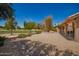 Lush backyard with gravel landscaping and views of the community golf course at 9243 W Kimberly Way, Peoria, AZ 85382